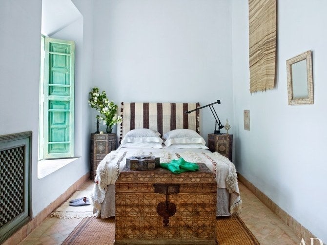 <p>An antique trunk, like this one in the bedroom of a home in Marrakech, makes for easy and pretty storage.</p>