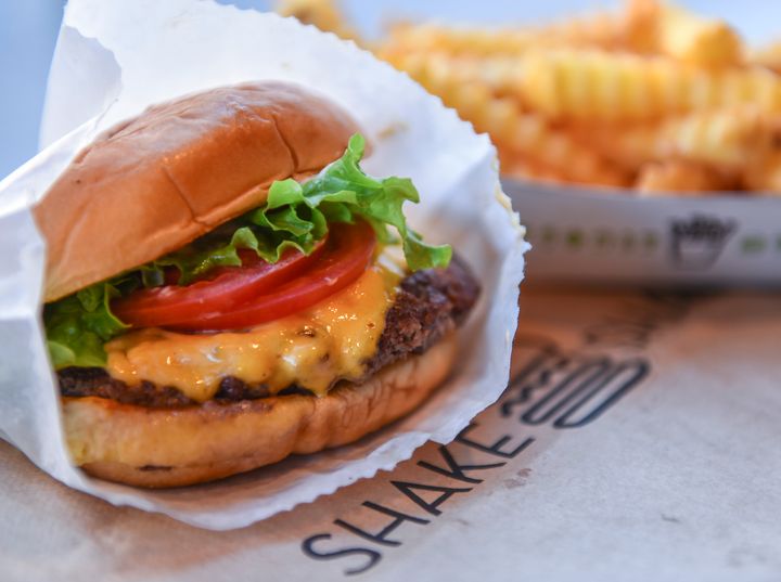 Shake Shack is charging customers more for its popular burgers after the chain increased employee wages last year. 