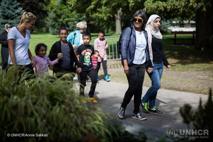 Thuy Nguyen and Narjes Nouman along with her family at a park on the Toronto Islands during an afternoon picnic with sponsors