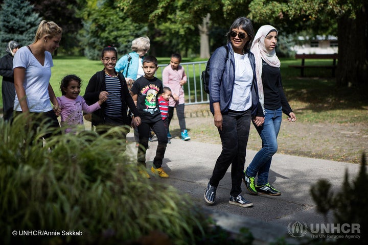 Thuy Nguyen and Narjes Nouman along with her family at a park on the Toronto Islands during an afternoon picnic with sponsors.