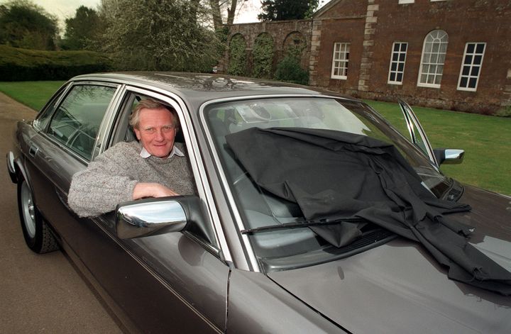 Lord Heseltine behind the wheel of a Jaguar in April 1995
