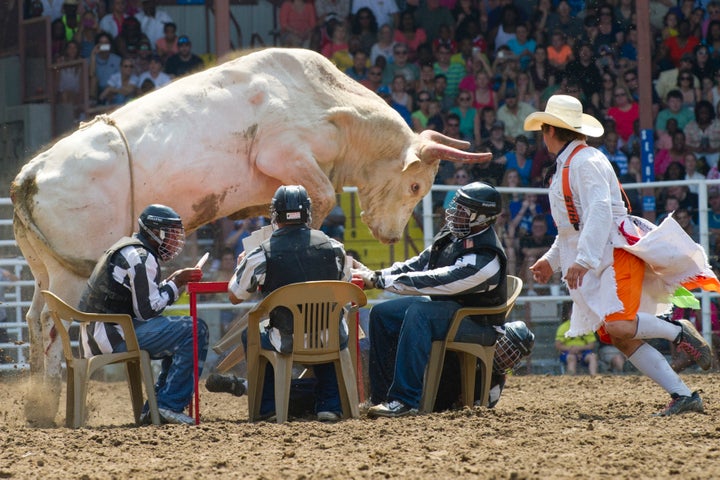 Inmates competing in "convict poker" during the Angola Prison Rodeo at the Louisiana State Penitentiary.