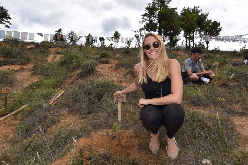 Cassie planting trees.