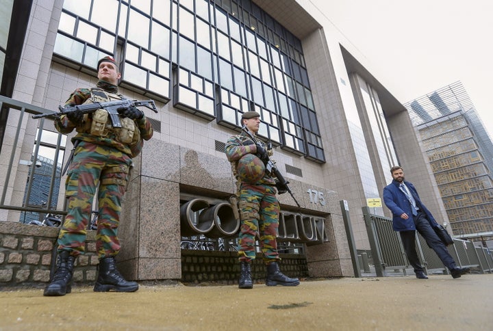 Armed soldiers stand guard outside the European Council headquarters, on Nov. 17, 2015. Salah Abdeslam, a French national who