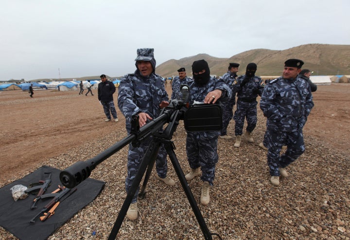 Members of the Iraqi security forces train as they prepare to fight against militants of the Islamic State, at a training camp on the outskirts of Mosul Jan. 10, 2015.