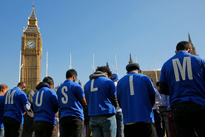 Muslims take part in Friday prayers during a Muslim Climate Action (MCA) event at Parliament Square in central London, October 9, 2015.