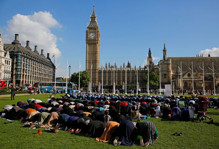 Muslims take part in Friday prayers during a Muslim Climate Action (MCA) event at Parliament Square in central London, Britain October 9, 2015.