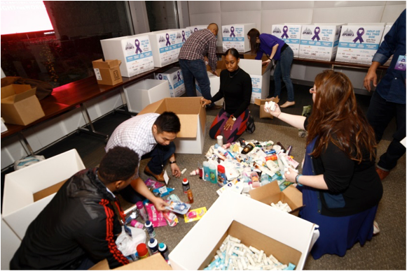 Viacom employees organize toiletries collected at Give Back & Get Down New York