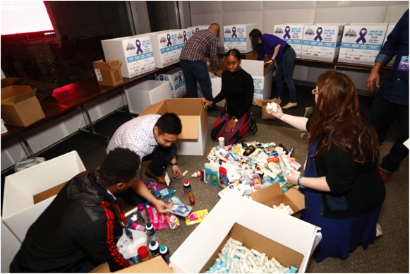 Viacom employees organize toiletries collected at Give Back & Get Down New York