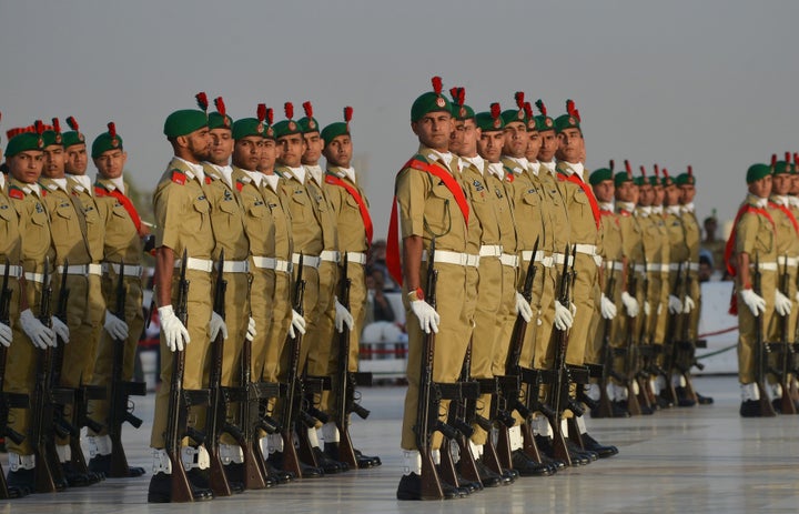 Pakistani military cadets march on the birth anniversary of the country's founder Mohammad Ali Jinnah at his mausoleum in Kar