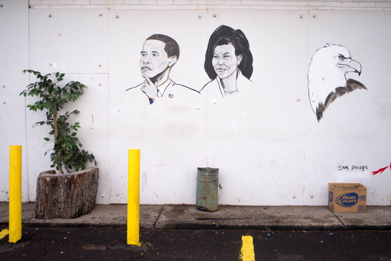 Mural depicting Barack and Michelle Obama with eagle by Sam Phillips, Fair Party Store, 6541 Gratiot Ave., Detroit, 2013.