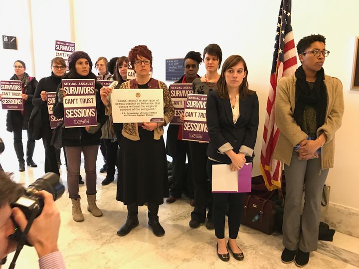 Sexual assault survivors protest outside Jeff Sessions' Senate office.