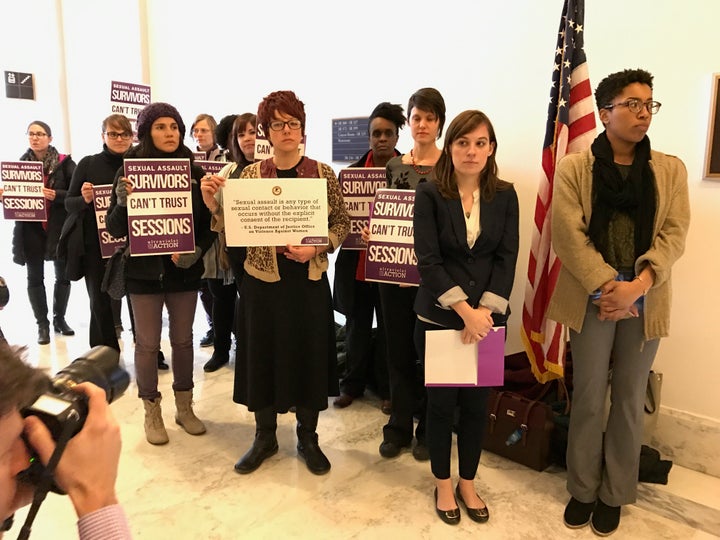 Sexual assault survivors protest outside Jeff Sessions' Senate office.