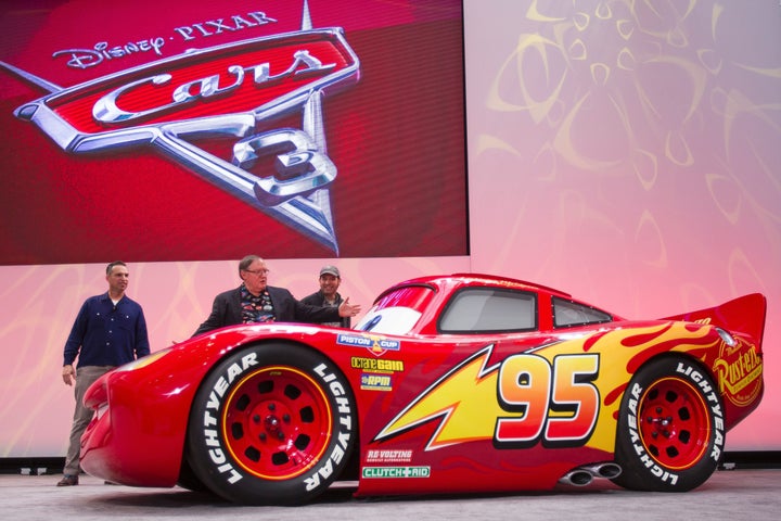 A life-size version of Lightning McQueen drives onstage to unveil his new paint job for the upcoming movie 'Cars 3'.