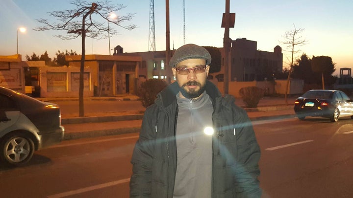 <p>Ahmed Maher outside the police station today where he is supposed to spend every night for the next three years</p>