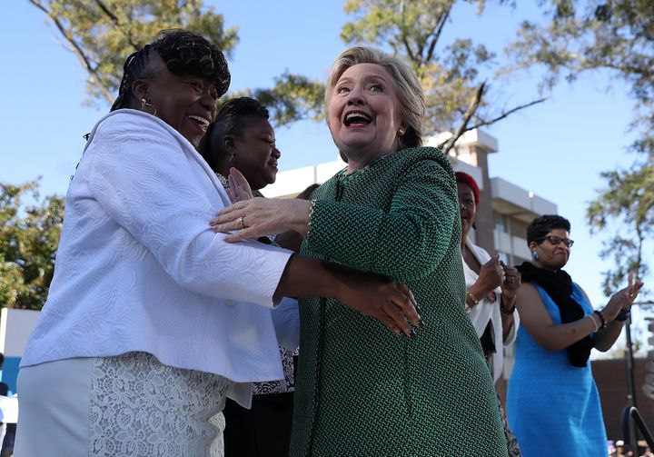 Democratic presidential nominee Hillary Clinton, right, hugs Gwen Carr the mother of Eric Garner, during a campaign rally in Raleigh, North Carolina.