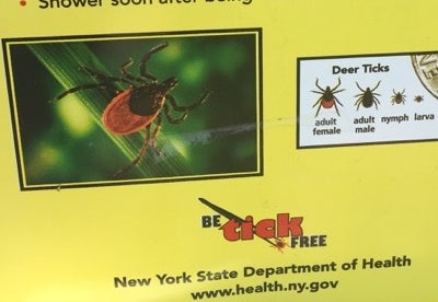 <p>A sign on a trail in New York State warns walkers.</p>
