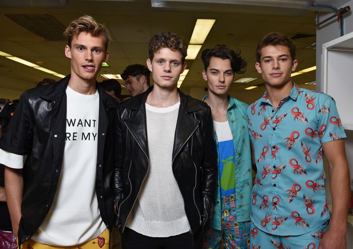 Models pose backstage at the Ricardo Seco fashion presentation during New York Fashion Week Men's S/S 2016 at Skylight Clarkson Sq on July 16, 2015, in New York City.