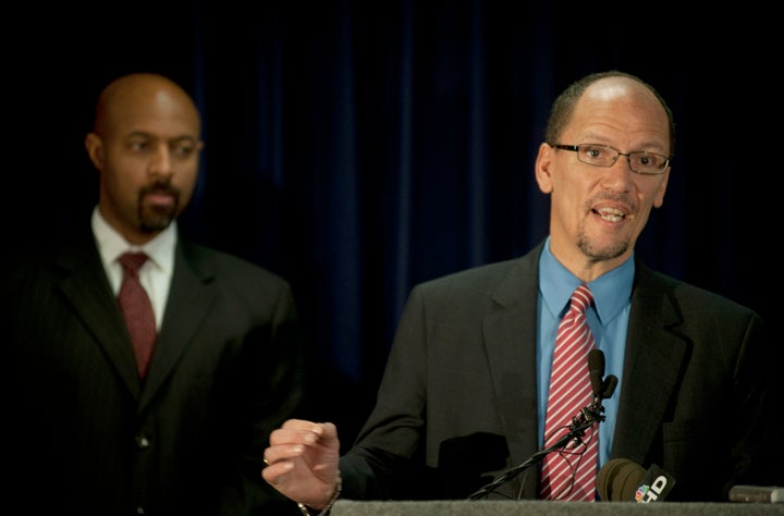 Tom Perez, right, then chief of the Department of Justice's Civil Rights Division, outlines racial profiling findings on the Maricopa County Sheriff's Office at a Dec. 15, 2011, news conference in Phoenix.
