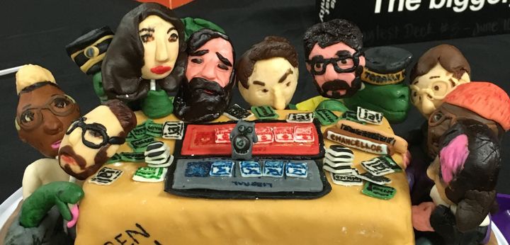 The Secret Hitler creators and friends playing the game in cake form.