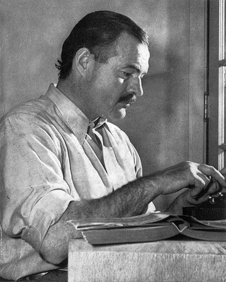 <p><em>Hemingway at work, late 1939</em></p>