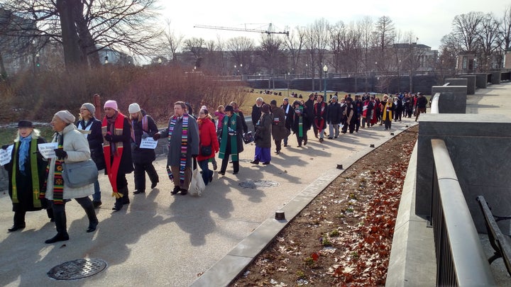 A long line of Moral Monday demonstrators, led by faith leaders, heads to the Senate to voice opposition to confirmation of Sen. Jeff Sessions as attorney general. 