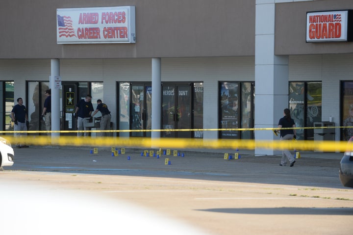 Members of the FBI Evidence Response Team work the scene of a shooting at a Armed Forces Career Center/National Guard recruitment office on July 16, 2015, in Chattanooga, Tennessee.