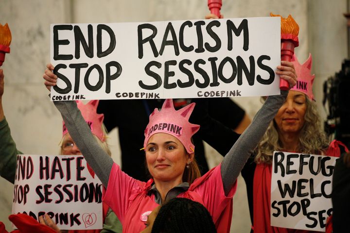 Protesters take positions at the start of a Senate Judiciary Committee confirmation hearing for U.S. Attorney General-nominee Sen. Jeff Sessions on Capitol Hill in Washington, U.S., January 10, 2017.