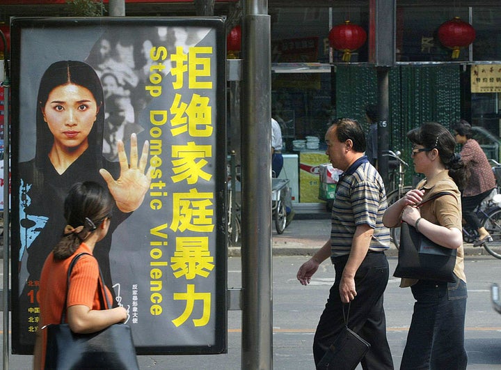 An old Chinese billboard ad calling for a stop to domestic violence. A new law that came into effect in March last year final