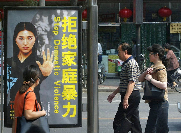 An old Chinese billboard ad calling for a stop to domestic violence. A new law that came into effect in March last year finally recognizes spousal abuse as an offense in its own right. But activists say the law is not being implemented effectively enough.