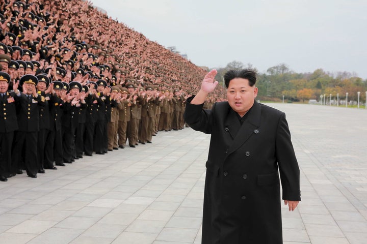 North Korean leader Kim Jong Un takes a memorial picture with attendants at KPA's (Korean People's Army) 7th military educati