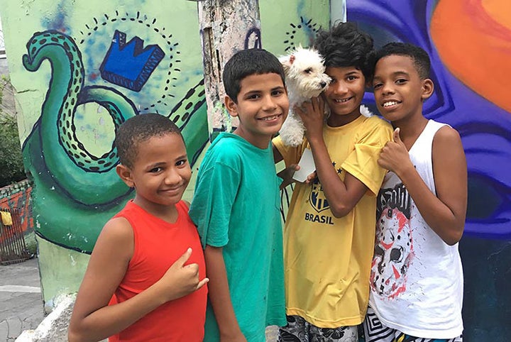 Young boys and their dog. Meeting Of Favela 2016. Favela Operaria. Duque de Caxias. Rio De Janeiro, Brazil. 