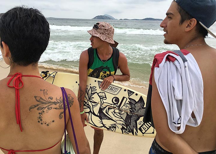 Chilean artists Jotael and Luciana Munoz enjoying Ipanema Beach the day after MOF. Meeting Of Favela 2016. Favela Operaria. Duque de Caxias. Rio De Janeiro, Brazil. 