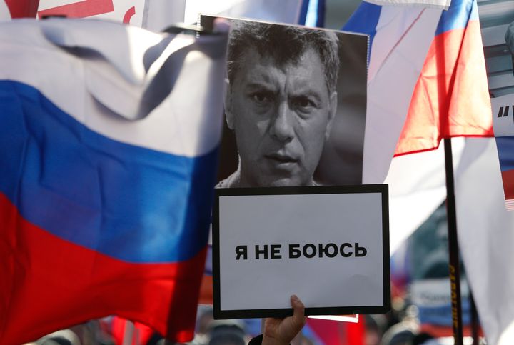 A participant carries a placard, which reads 'I'm not afraid', during a rally in memory of Russian opposition politician Boris Nemtsov. 
