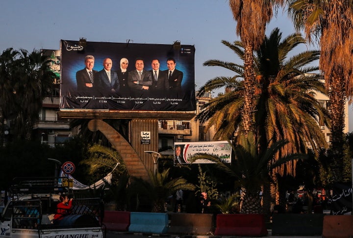 An election campaigning poster in a street in the Syrian capital, Damascus, ahead of the April 13 parliamentary elections. 