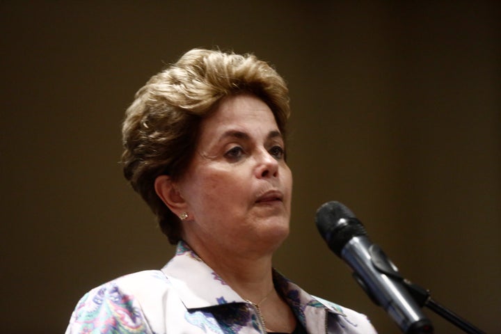 Brazil's Supreme Court suspended impeachment proceedings against President Dilma Rousseff until it rules on the validity of a secret ballot that stacked a congressional committee with opponents seeking to oust the leftist leader.