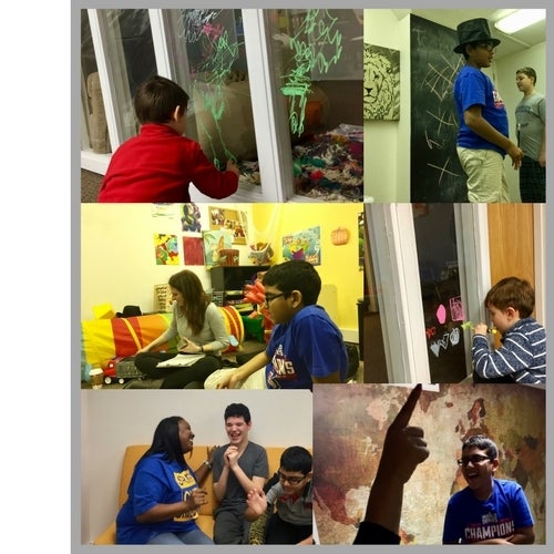 Kiddos enjoying creative spaces like chalkboard walls, dry-erase walls, map walls, and colorful couches.