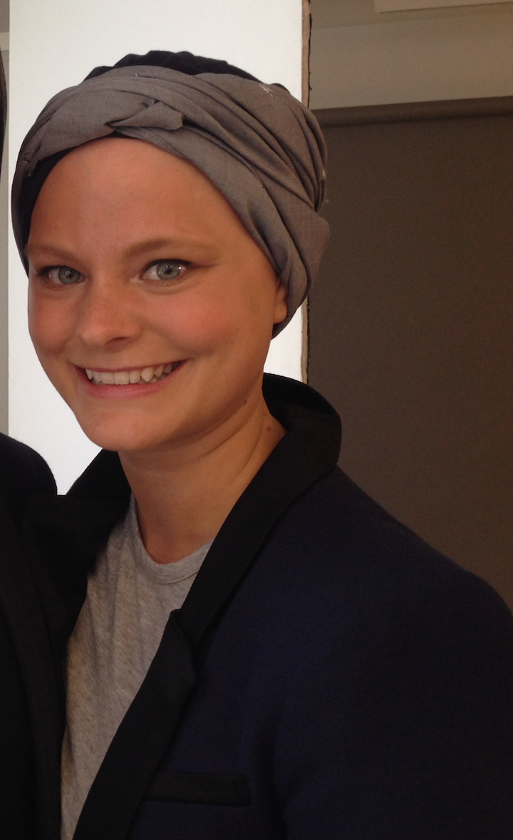 Transitions Hair Solutions client Malin Mumford stylishly wears a headscarf. 