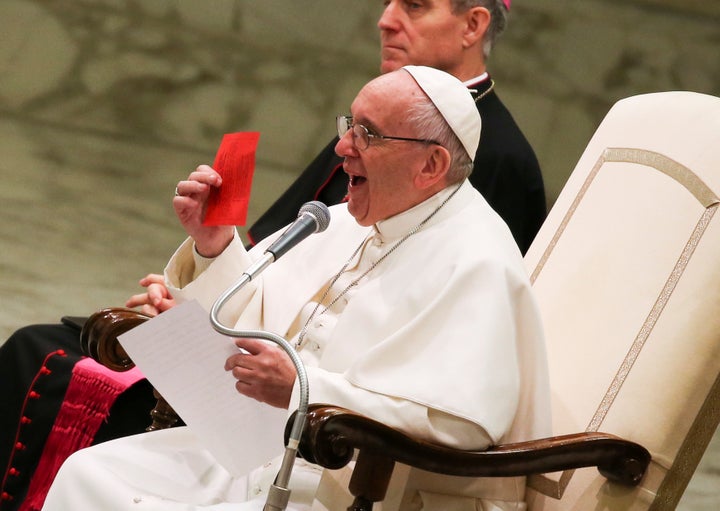 Pope Francis shows a free ticket during his Wednesday general audience in Paul VI hall at the Vatican January 11, 2017.