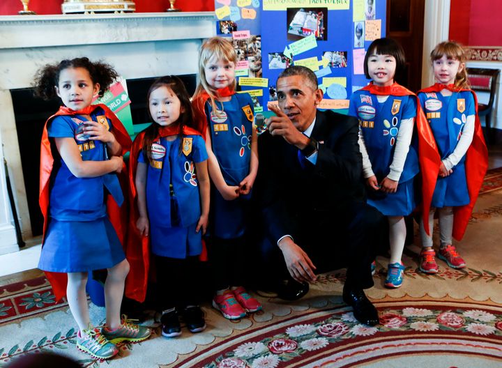 President Barack Obama poses with a group of 6 years old Girls Scouts from Tulsa Oklahoma who designed a battery powered page turner to help people who are paralyzed or have arthritis at the 2015 White House Science Fair.