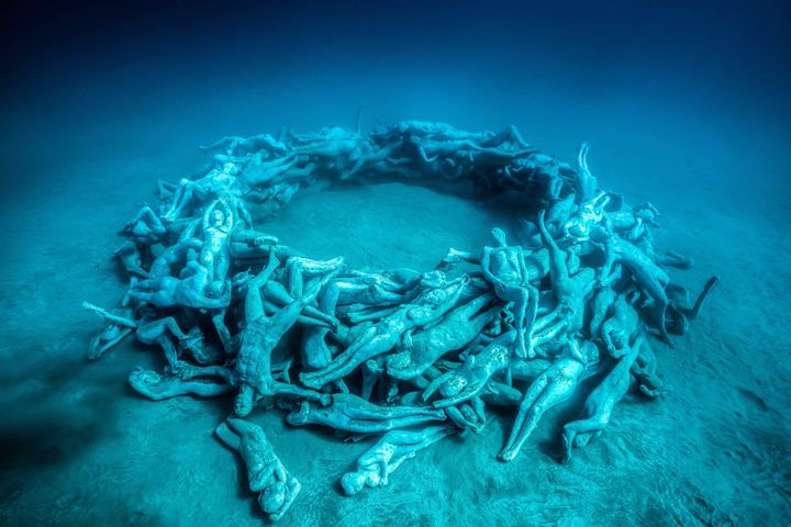 “Human Gyre” includes 200 life-size beings woven into a circle, reminding us we’re vulnerable under the ocean's power. The sculpture is a complex artificial reef for marine animals.