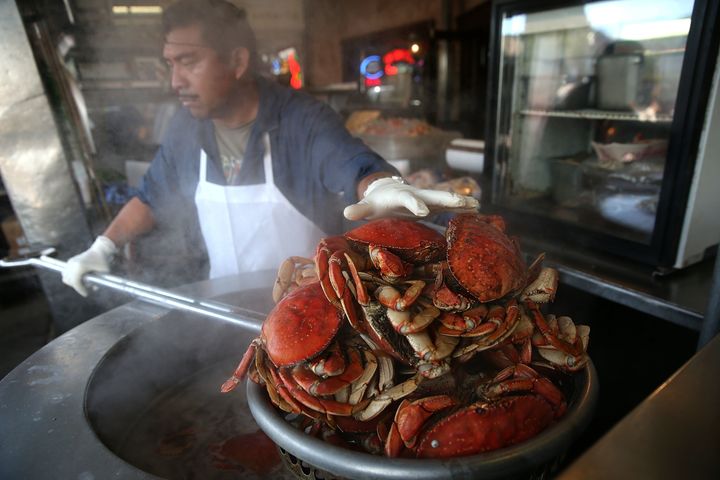 A cook at Nick's Lighthouse prepares Dungeness crab on November 5, 2015 in San Francisco, California. The California Fish and Game Commission suspended recreational Dungeness crab fishing for 180 days in 2015 due to high levels of domoic acid, a neurotoxin.