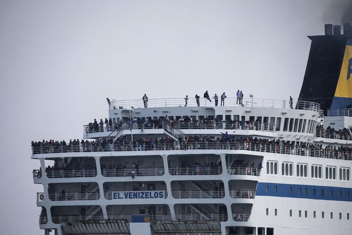 Refugees and migrants are seen on board the Eleftherios Venizelos passenger ferry. 