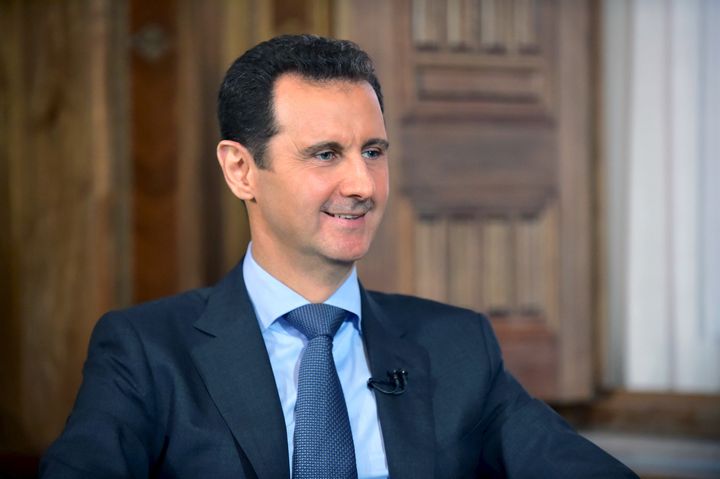 Syria's President Bashar al-Assad answers questions during an interview with al-Manar's journalist Amro Nassef, in Damascus, Syria. 
