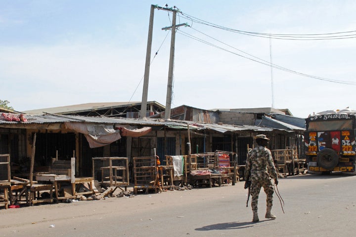 At least eight people were killed and about 100 others were kidnapped by suspected Boko Haram militants in an overnight raid on a village near Cameroon's northern border. 