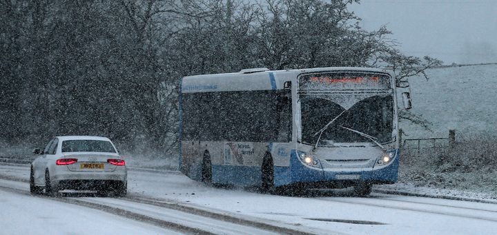Traffic moves in snowy conditions in Ballymena, Co Antrim