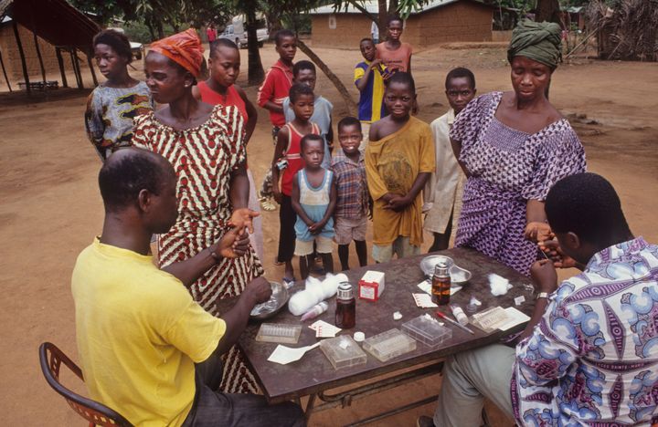 Technicians take blood samples from a village in Ivory Coast to test for parasites that cause sleeping sickness. The disease mainly infects communities in Africa.