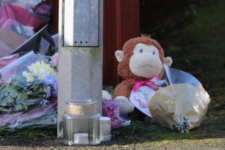 Floral tributes and a teddy bear are left for Katie 