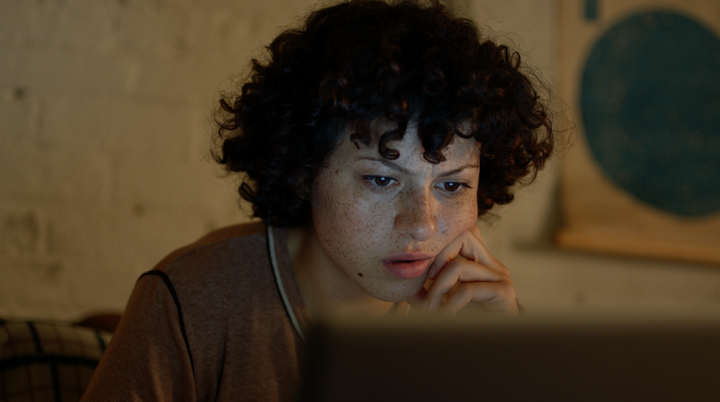 Alia Shawkat's character spends many late-night hours in front of her laptop trying to piece together the conspiracy behind h