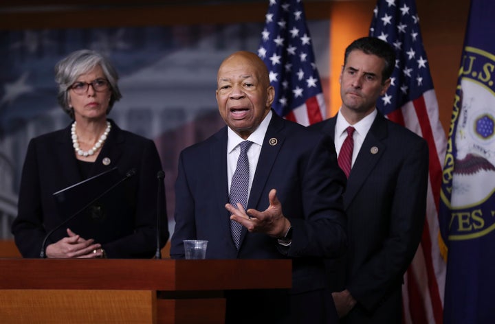 Rep. Elijah Cummings, D-Md., center, accompanied by Rep. John Sarbanes, D-Md., right, and Rep. Katherine Clark, D-Mass., spea